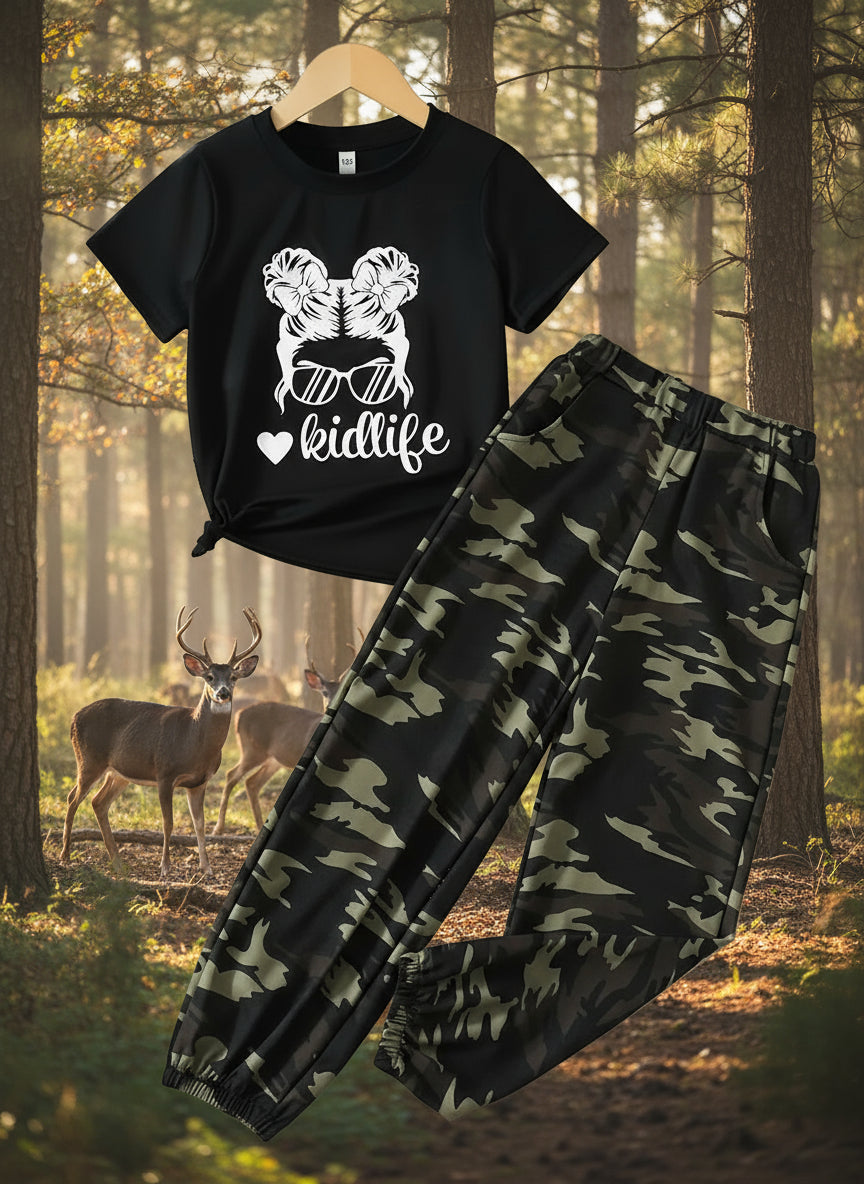 Two-piece girls' outfit set with a black top featuring a graphic and the text 'kid life', and camouflage print pants.